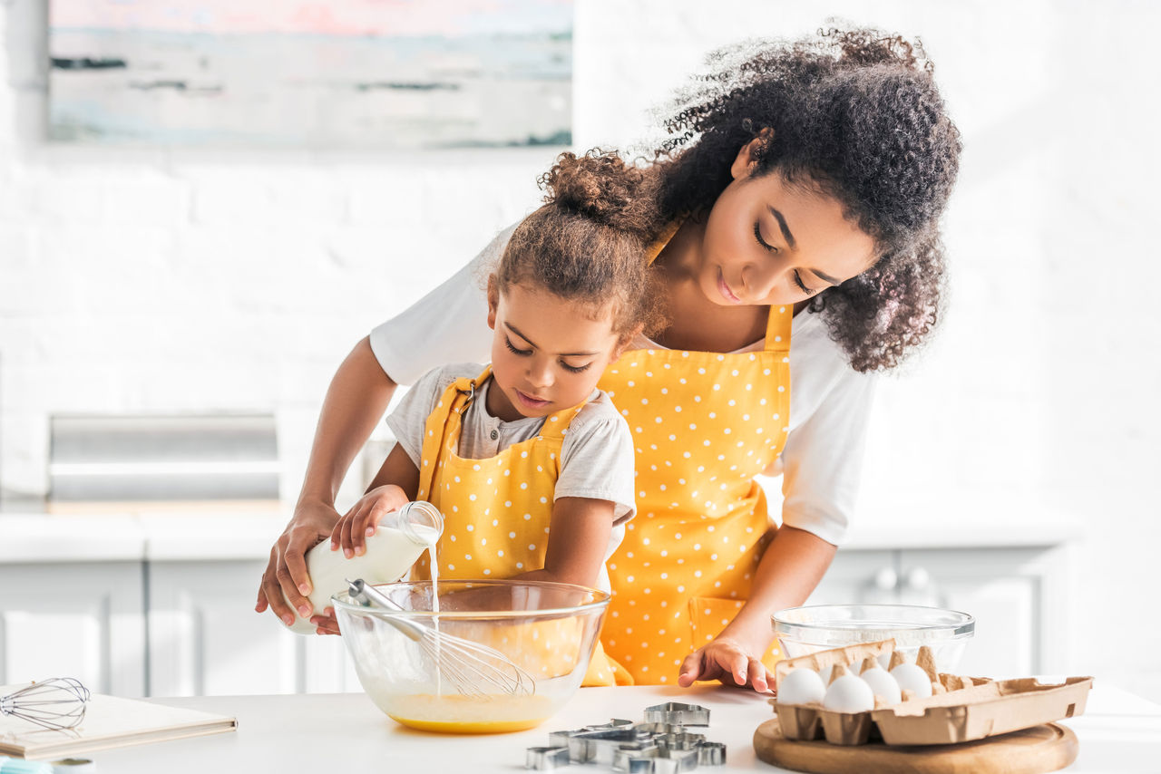 Mother and child cooking in the kitchen